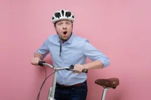shocked-caucasian-man-bike-pink-background (1)